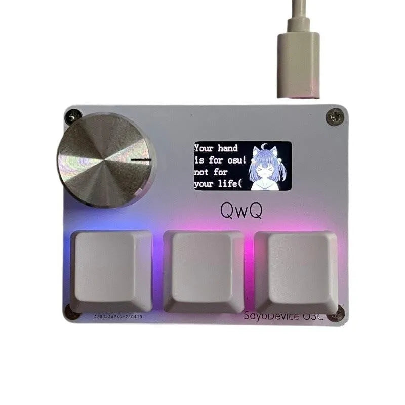 Customisable magnetic axis gaming keypad with programmable knob and colour IPS screen on desk.