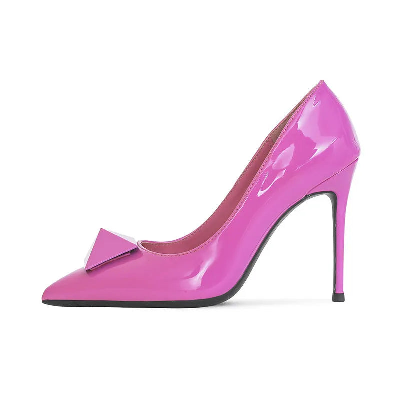 Women's pink patent leather stiletto heels with pointed toe, buckle ankle strap, and stiletto heel