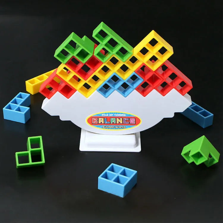 Balance stacking game with 16 plastic building blocks, chassis, and base on a table