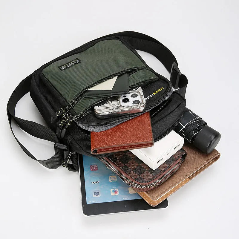 Men's nylon crossbody bag in solid colour with multiple pockets and adjustable shoulder strap