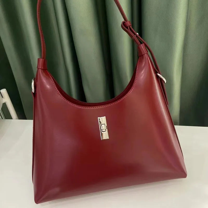 Genuine leather dumpling-shaped crossbody bag in apricot colour with shoulder strap