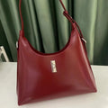 Genuine leather dumpling-shaped crossbody bag in apricot colour with shoulder strap