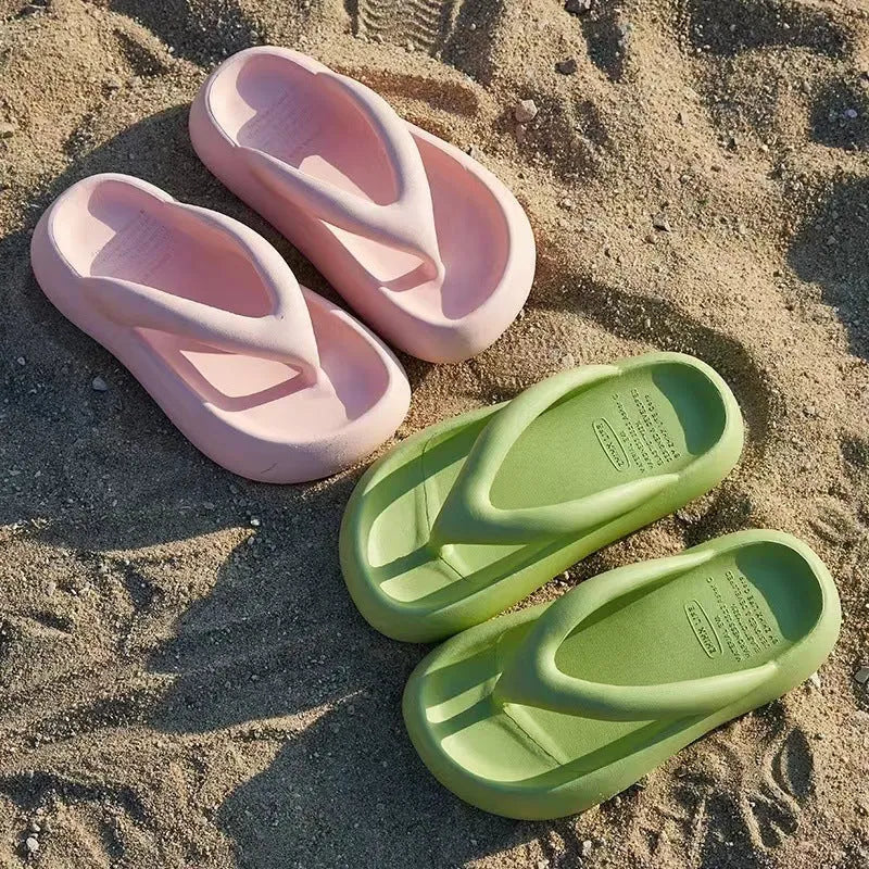 Women's solid colour EVA flip-flops with a thick sole and a bow detail on the upper.