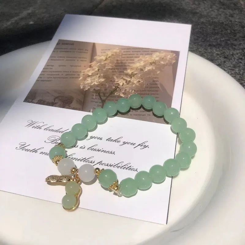 Chinese style bamboo leaf glass bracelet for women with a bamboo joint design.