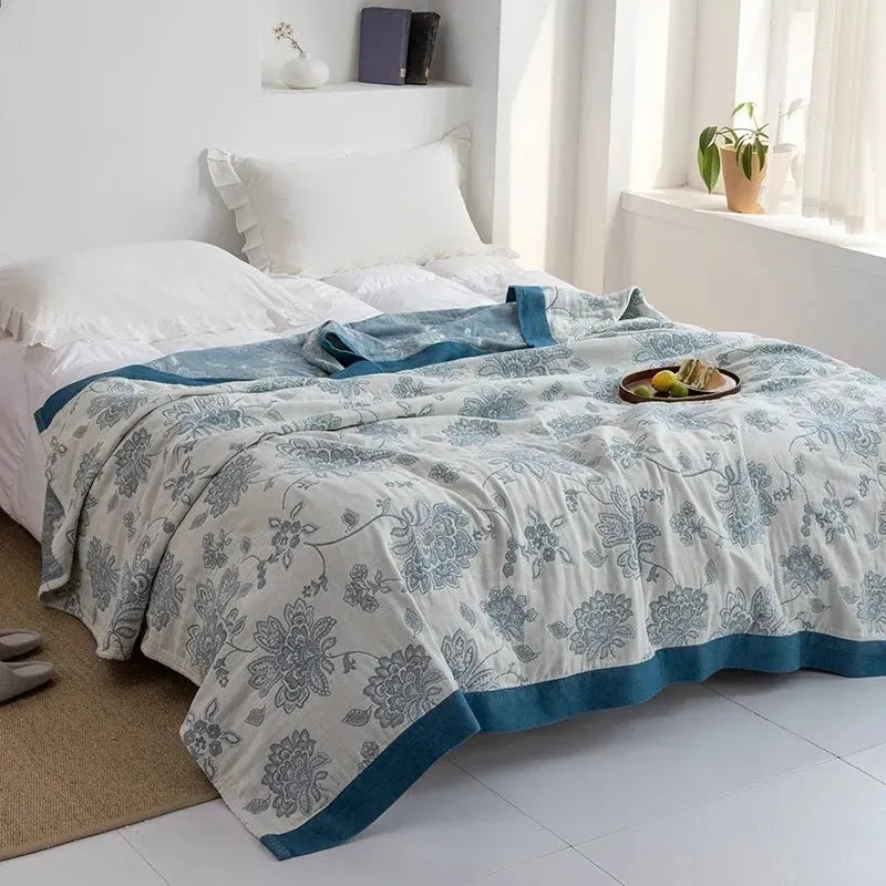 Five-layer cotton gauze bed blanket with Roulette Wheel Blue pattern showing modern simplicity design