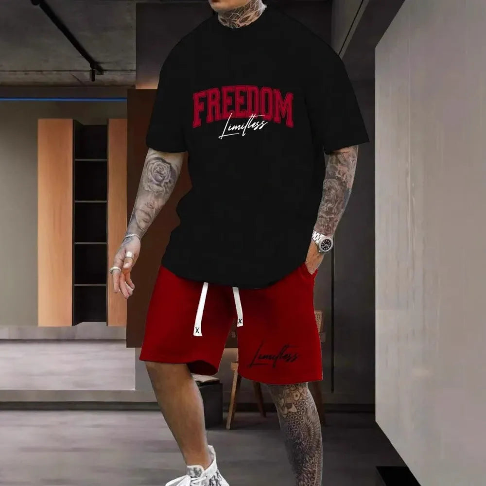 Men's grey sports suit with 3D printed white lettering on the short sleeve top and matching shorts.