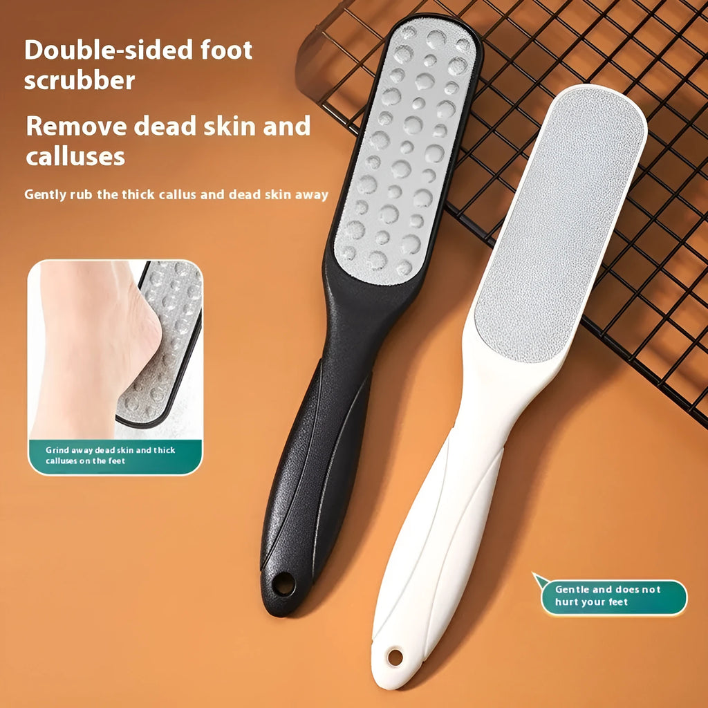 Double-sided stainless steel foot grinder with black and white grit attachments for callus removal