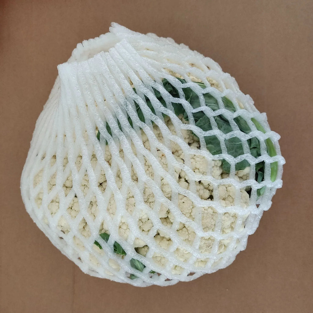 White foam net cover for fruit protection shown in various sizes on a table.