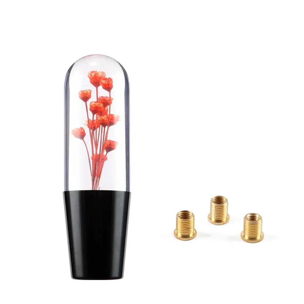 JDM crystal car gear knob with flower-in-water design, 15cm long, shown with three fitting adapters
