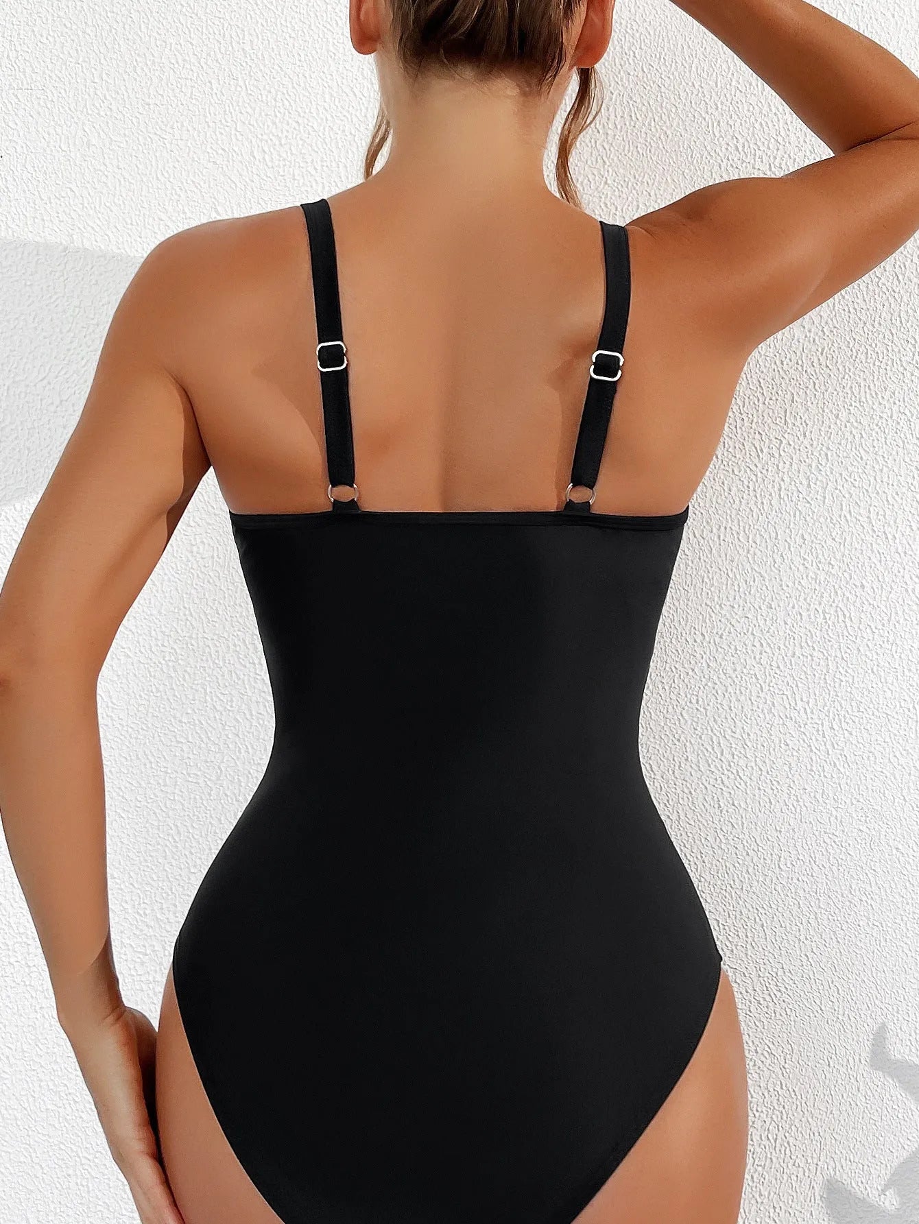 Black women's halter one-piece swimsuit with briefs cut in nylon fabric