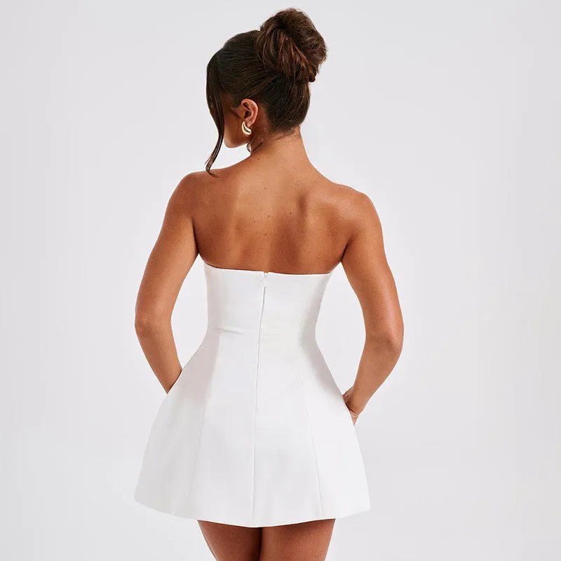 Women's solid colour backless tube dress with A-line skirt and high waist in various colours.