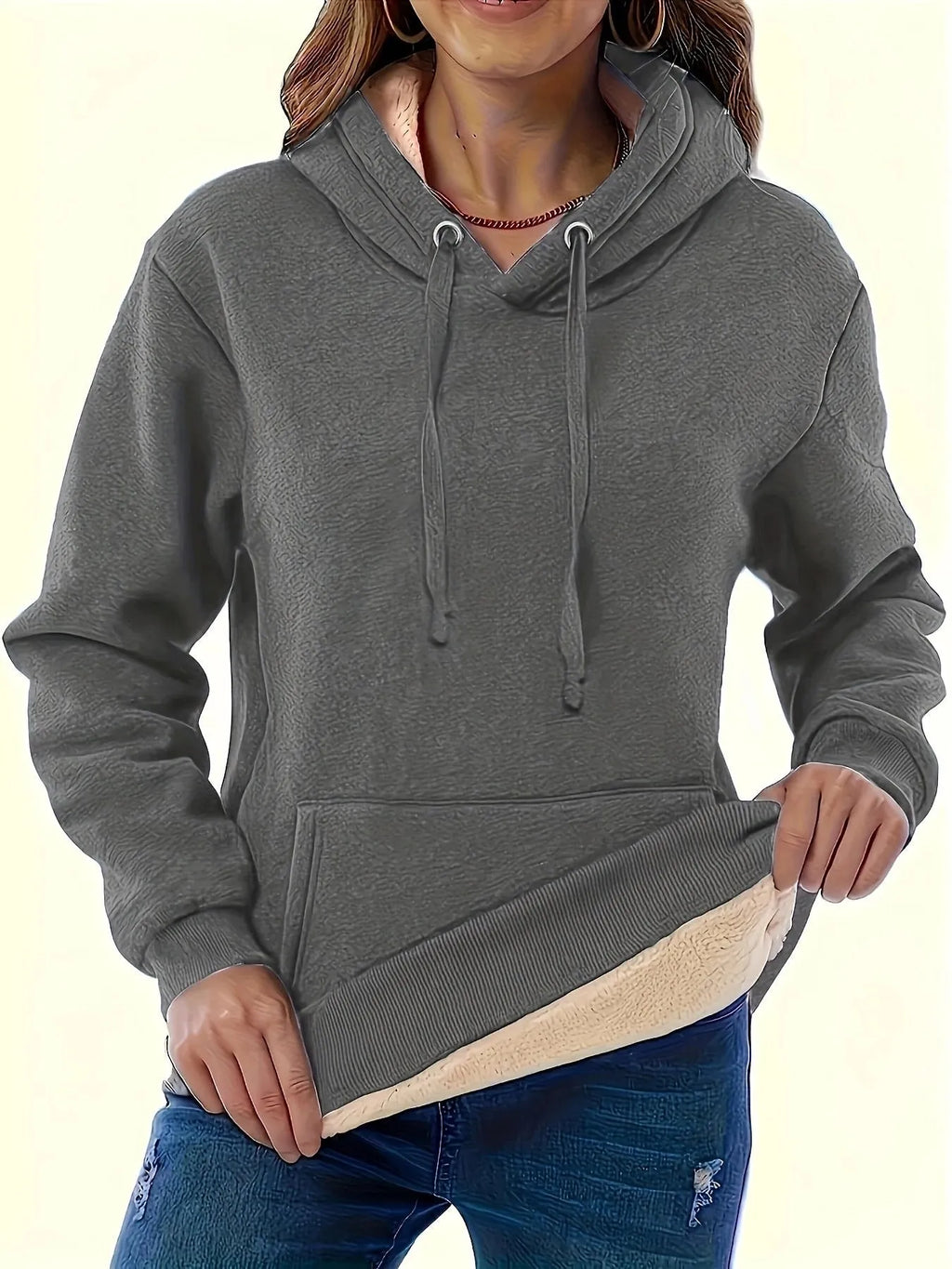Women's loose-fit black hooded sweater with side pockets and a 3D pattern on the front.