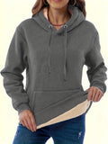 Women's loose-fit black hooded sweater with side pockets and a 3D pattern on the front.