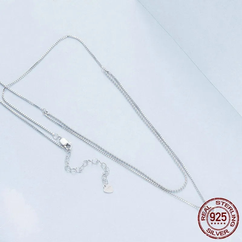 Women's sterling silver double-layer necklace with pearl chain and contemporary pendant