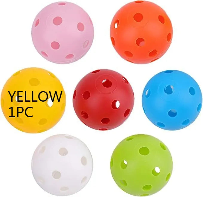 Multi-colour golf practice balls in net bag with 26-hole putting layout for skill development