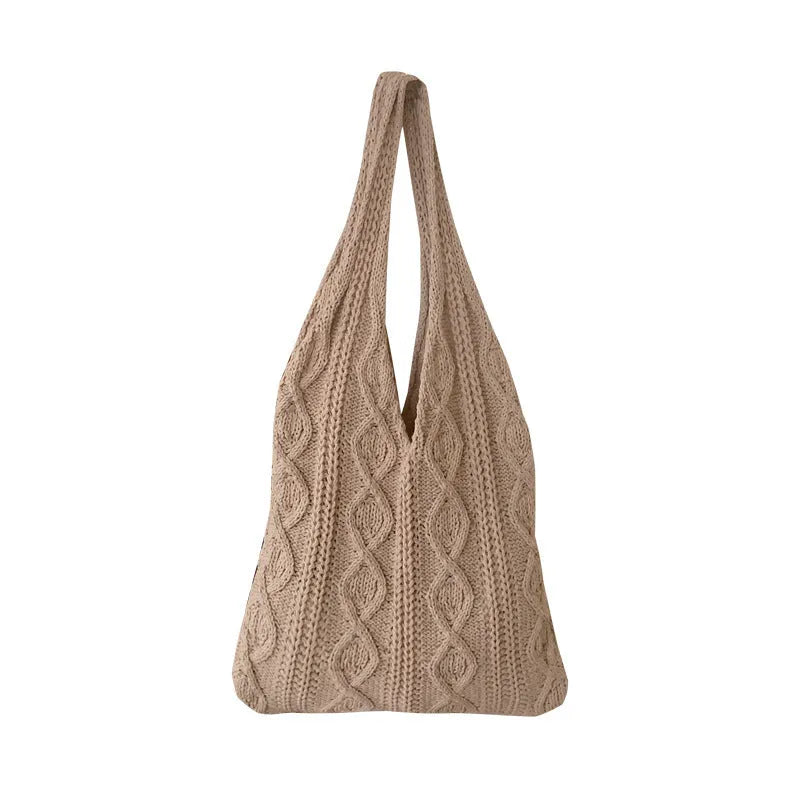 Women's crochet knitted shoulder tote bag in a solid colour with hollow retro design and double straps.