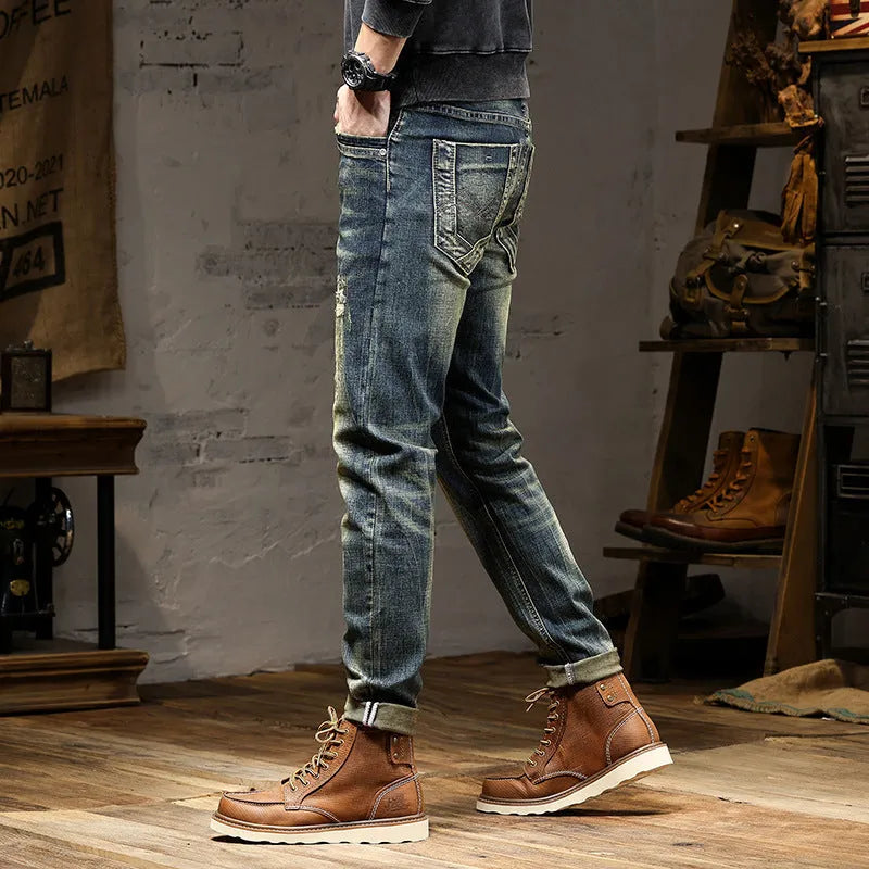 Men's retro blue stretch denim jeans with zip fly, shown in a slim-fit style