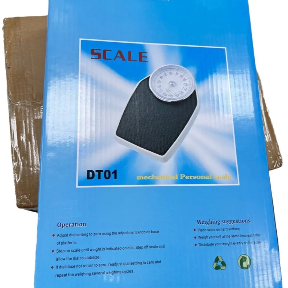 Black mechanical body weight scale with large dial on a simple platform