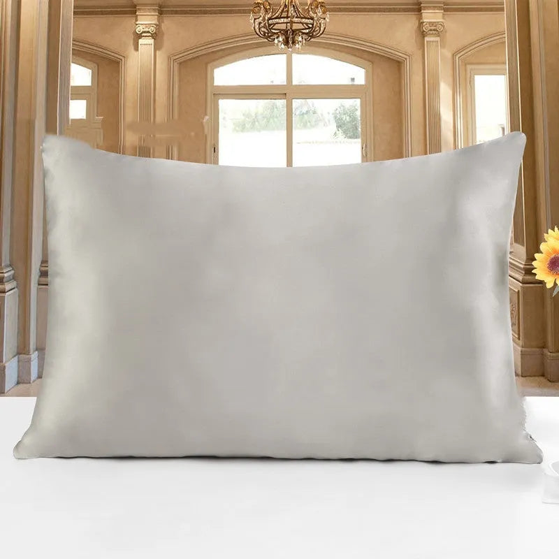 Double-sided 19 M silk pillowcase in apricot colour, showing smooth satin weave texture.