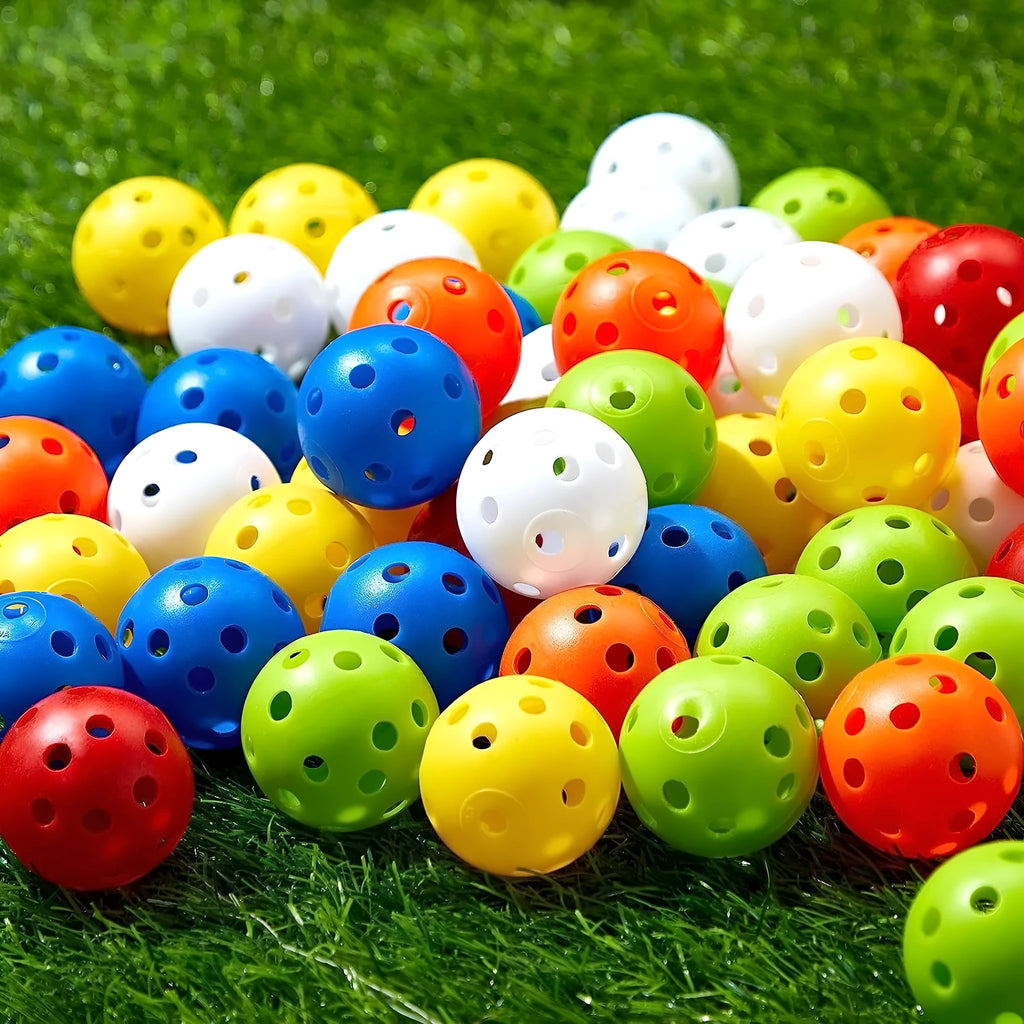 Multi-colour golf practice balls in net bag with 26-hole putting layout for skill development