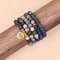 Blue multi-layer bracelet with patterned network stone beads on an alloy chain.