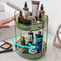 Three-layer rotating bathroom cosmetics storage rack in green, yellow, and white on a desktop