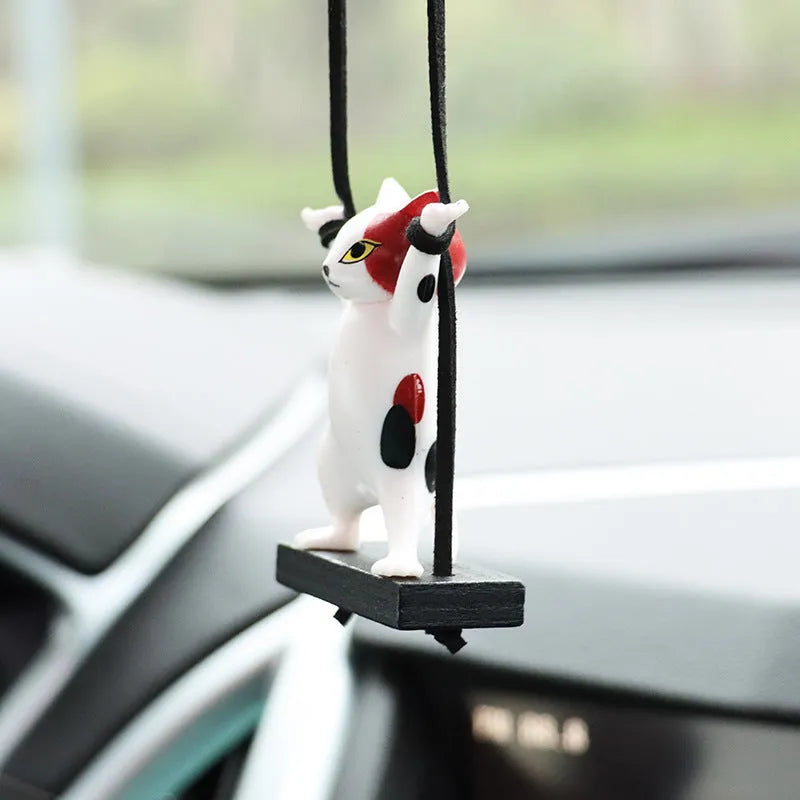 Cartoon-style resin cat pendant on a rope for car interior decoration