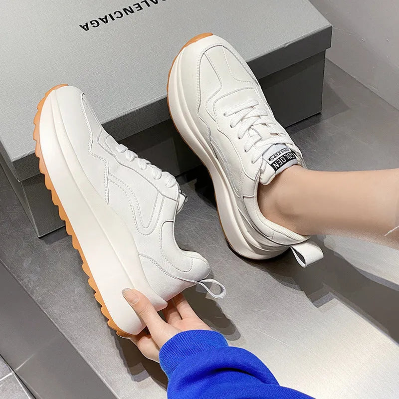 Beige women's low-top leather casual sports shoes with lace-up fastening and round toe.