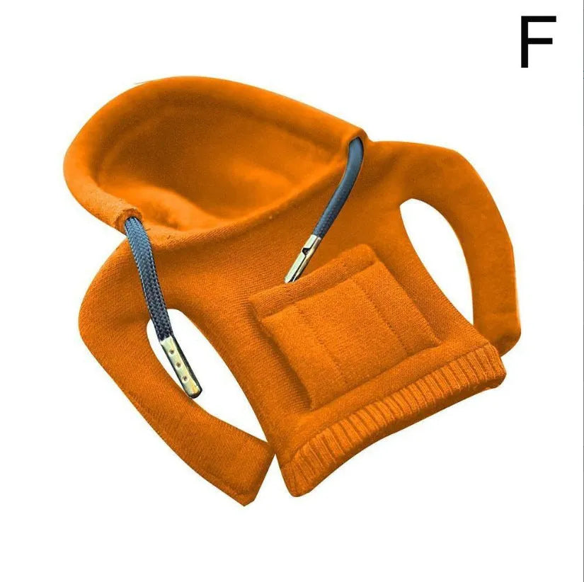 Cloth gear shift knob hoodie cover in assorted colours, shown next to a car gear stick.