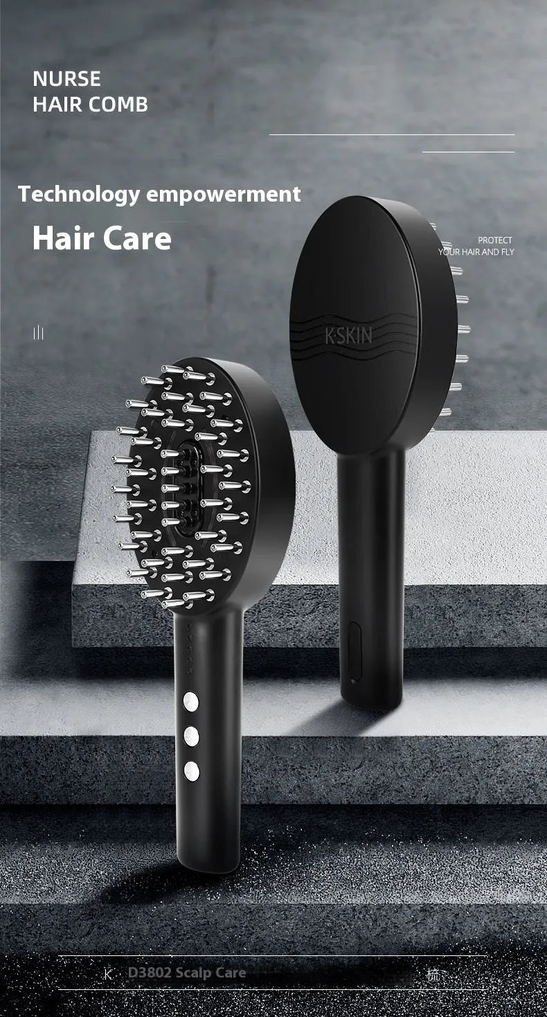 Black handheld electric scalp massage device with a charging cable on a white background.