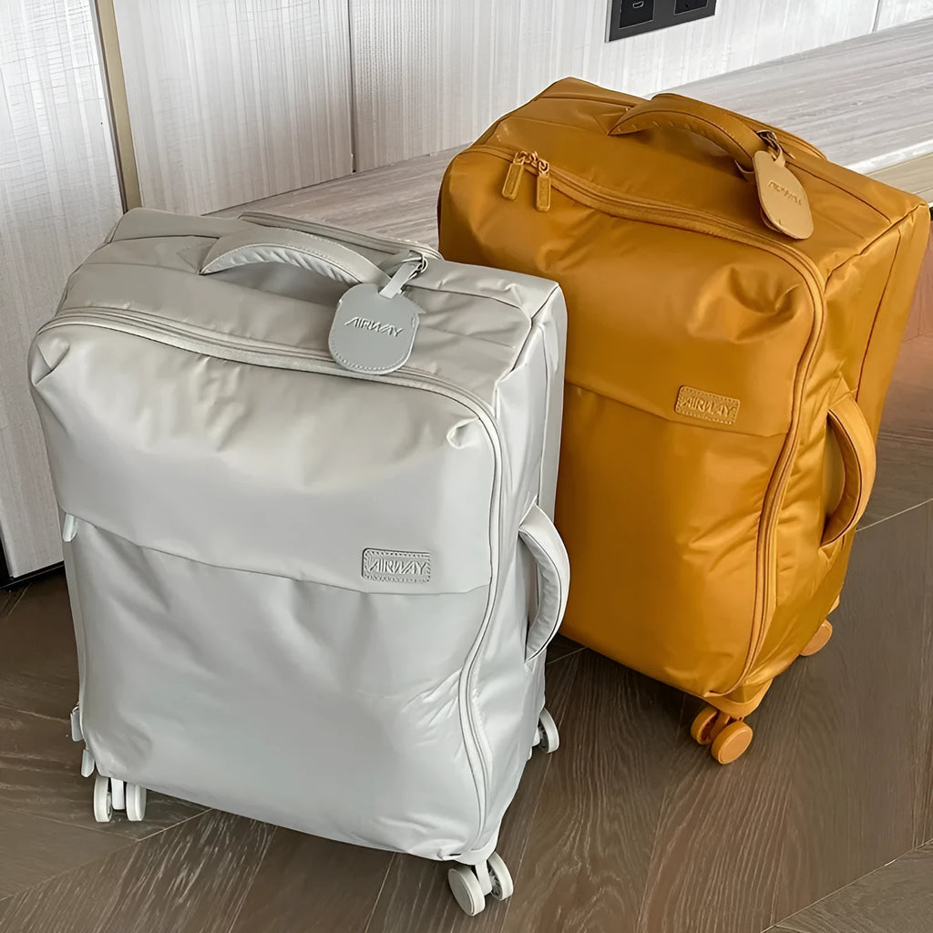 Ultra-light waterproof Oxford cloth suitcase in bluestone green with universal wheels, shown in a 24-inch size.