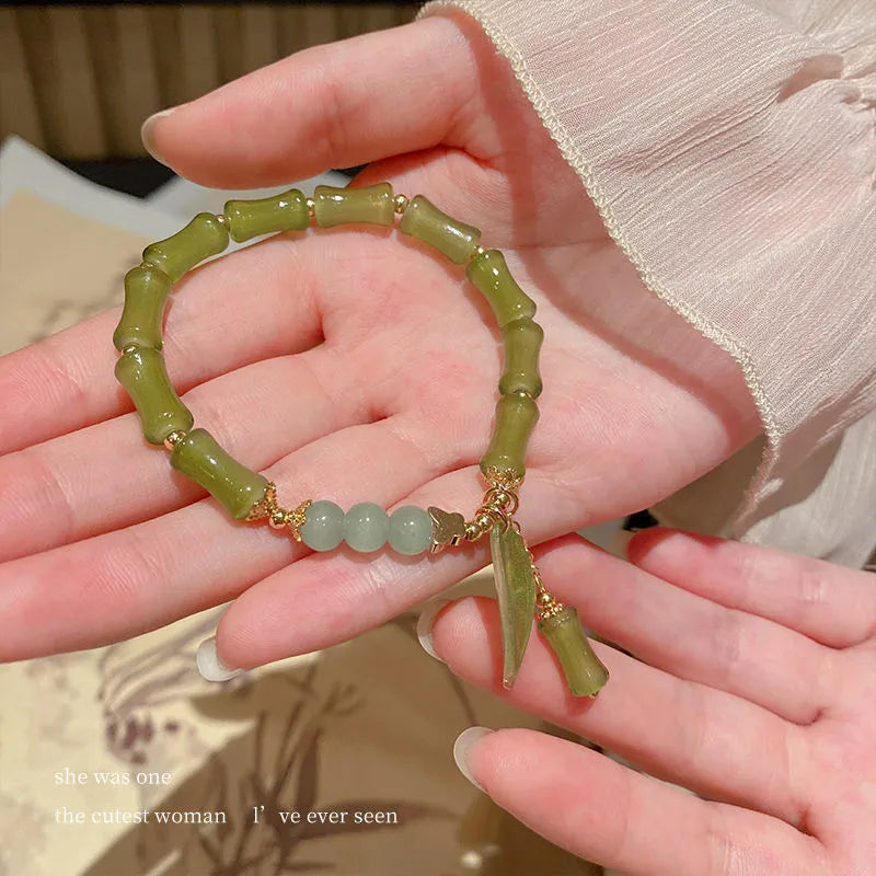 Chinese style bamboo leaf glass bracelet for women with a bamboo joint design.