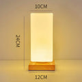 Nordic style solid wood USB table lamp in white geometric shape with touch dimming control