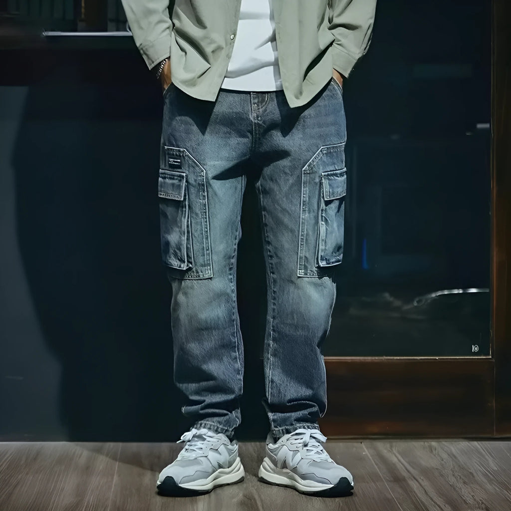 Blue men's loose fit straight-leg jeans with a zip fly on a mannequin