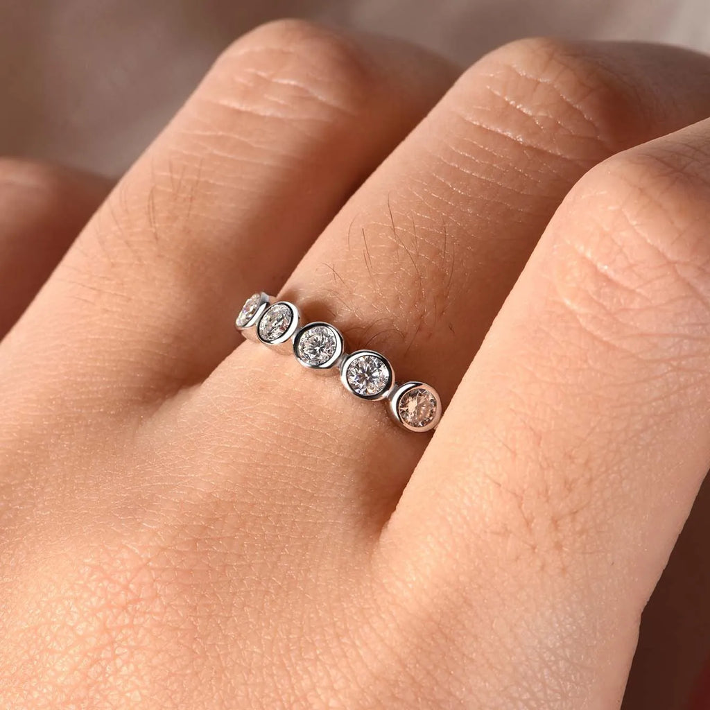 925 silver round moissanite ring with white gold electroplated finish on a geometric band, available in sizes 5 to 9
