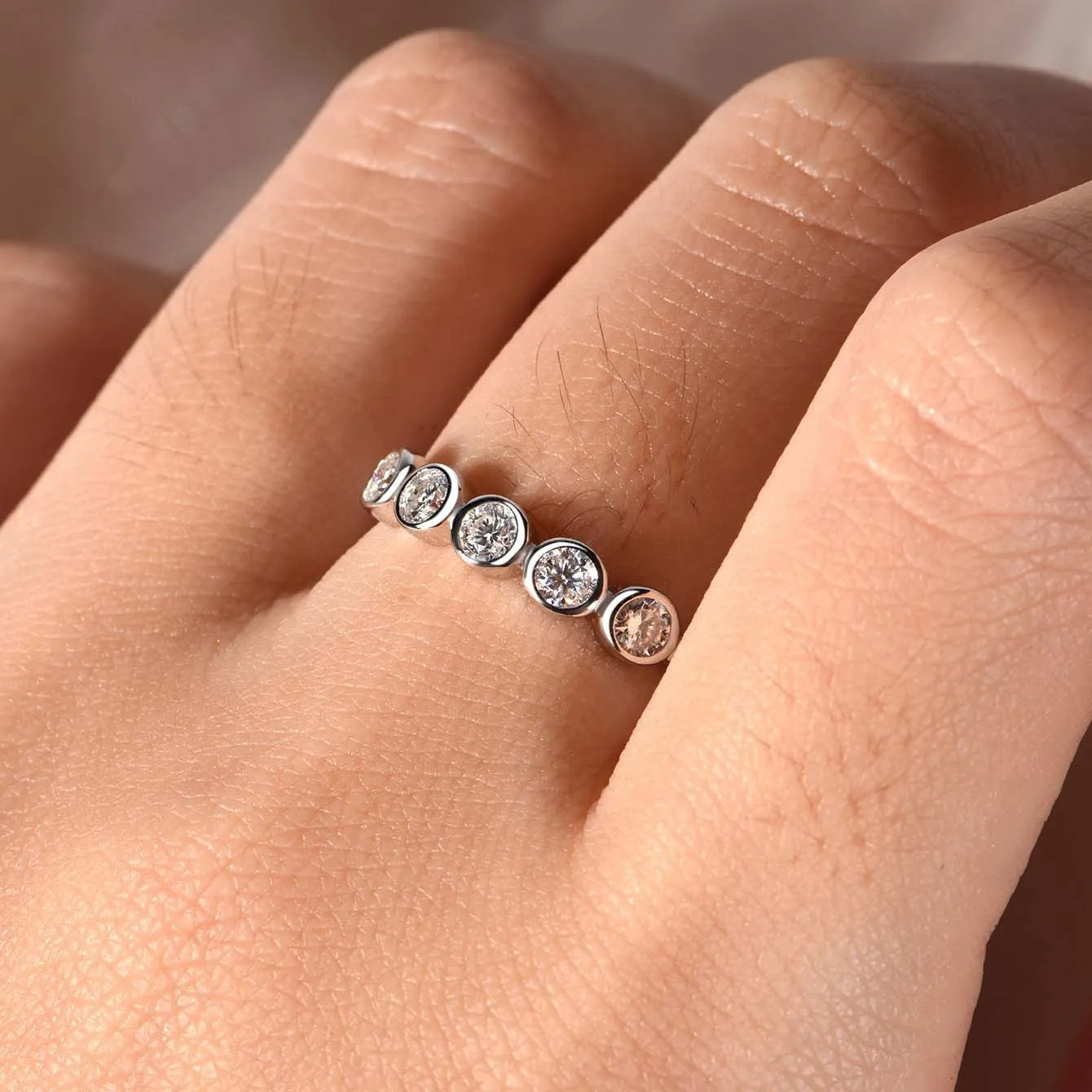 925 silver round moissanite ring with white gold electroplated finish on a geometric band, available in sizes 5 to 9