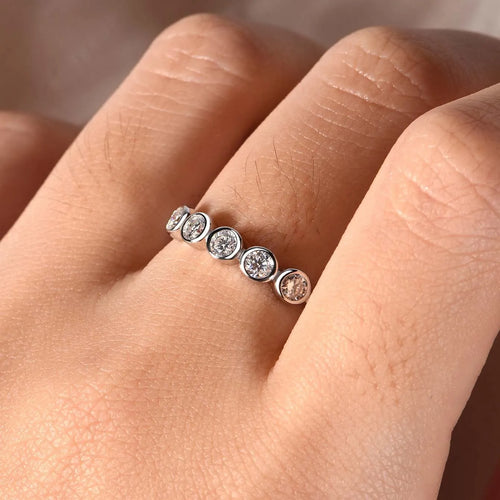 925 silver round moissanite ring with white gold electroplated finish on a geometric band, available in sizes 5 to 9