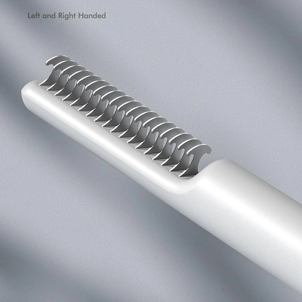 Pink and white stainless steel dematting comb for dogs with ergonomic handle on a plain background.