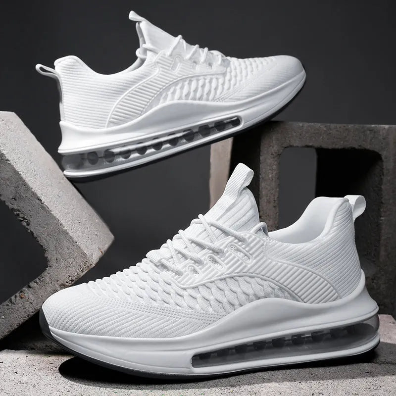 Men's solid colour mesh running sneakers with a round toe and lace-up front on a rubber sole.