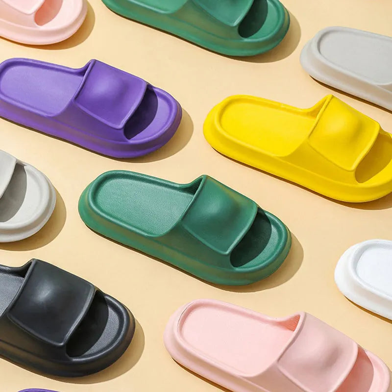 A pair of thick-soled EVA foam flip-flop slippers in a choice of seven colours on a plain background.