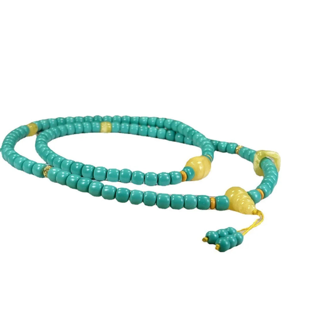 Turquoise lucky pendant necklace with hand-woven mesh flower stone design on a ball bead chain.