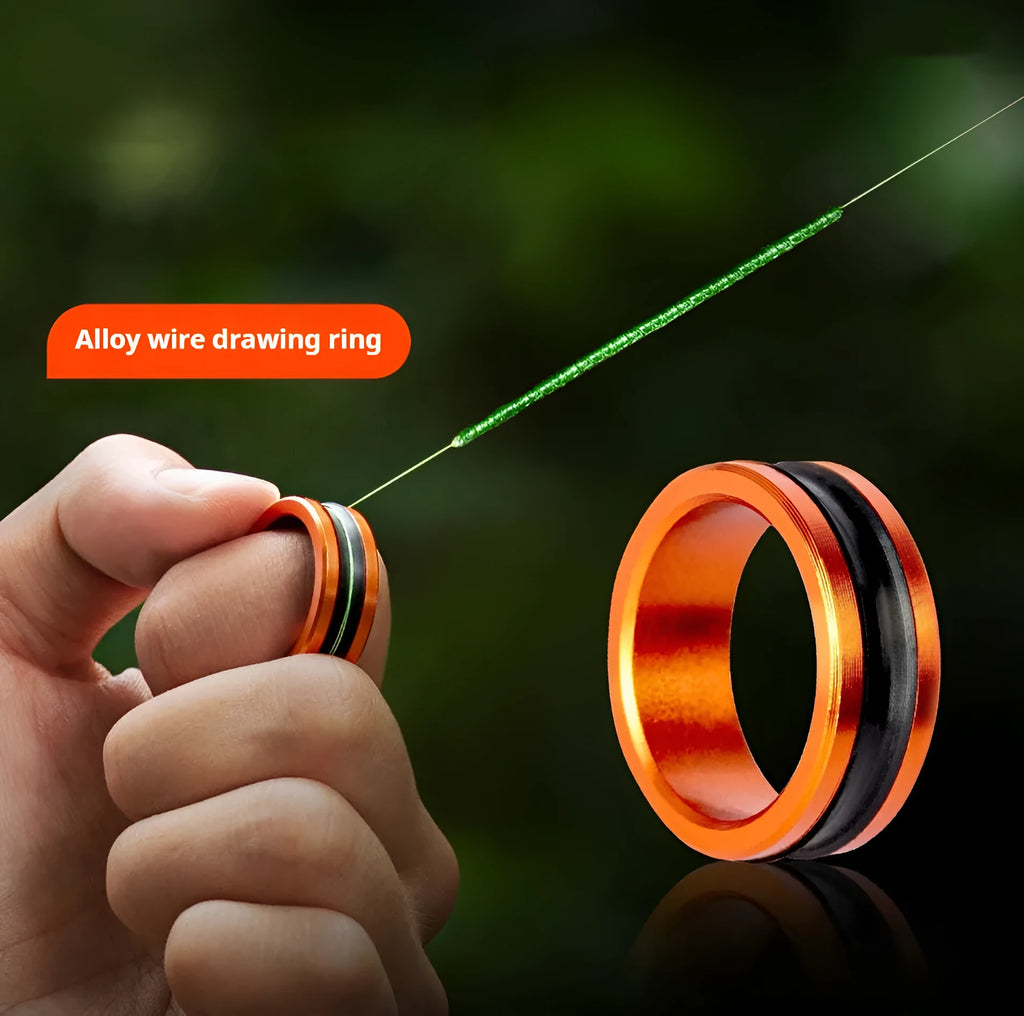 Orange and silver alloy fishing pull loop tool with non-slip grip ring.