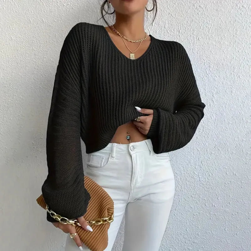 Women's solid colour long sleeve polyester pullover jumper in regular fit, shown in available colours.