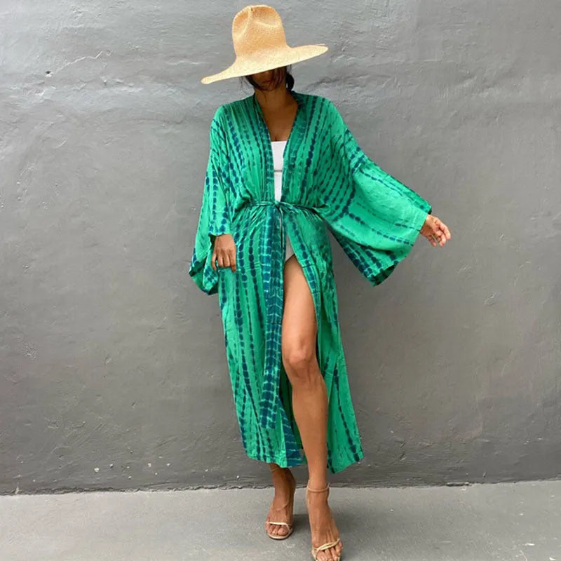 Printed loose cotton bikini cover-up blouse on hanger showing multiple DN0712 colour options.
