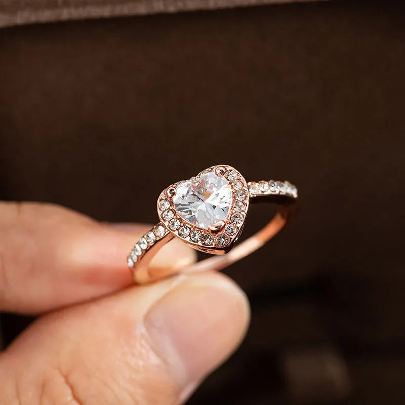 Women's heart-shaped crystal wedding ring with electroplated rose gold finish on white copper