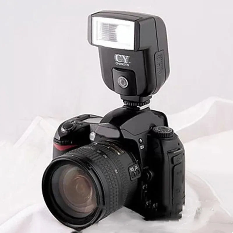 Compact SLR camera flash unit with its head tilted upwards, showing hot shoe mount.