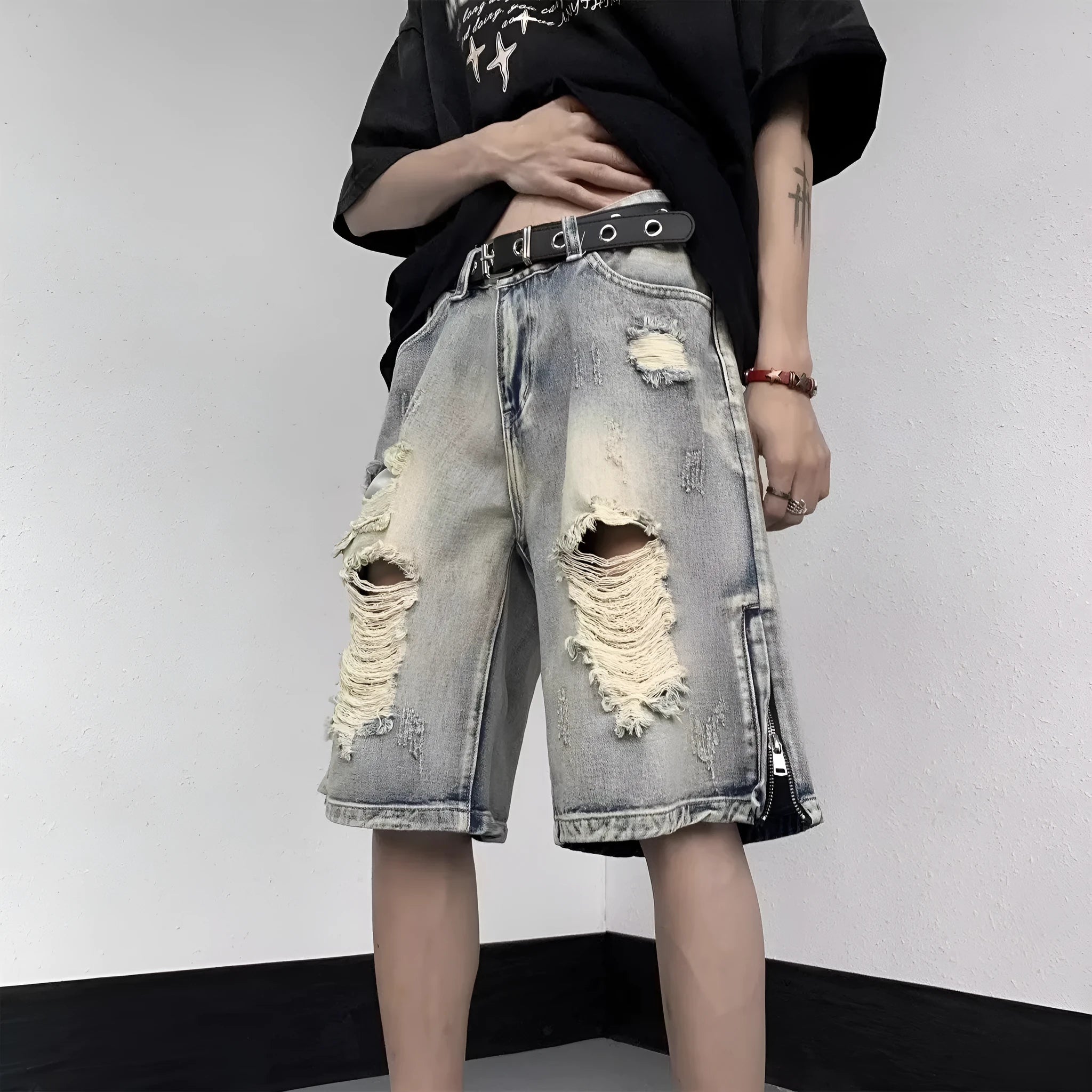 Blue retro denim shorts with a wide-leg loose fit and tattered distressing on the legs.