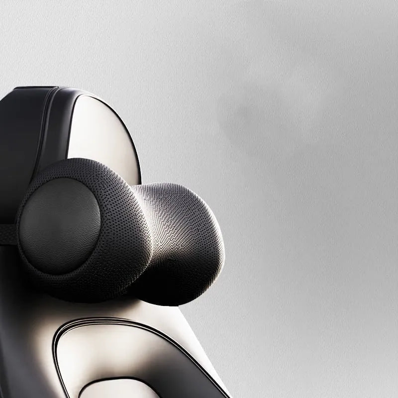 Classic black memory cotton car massage cushion shown as a headrest and lumbar support on a car seat.