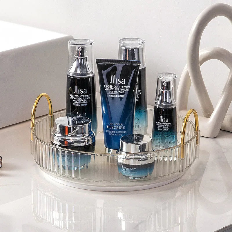 Three-layer rotating bathroom cosmetics storage rack in green, yellow, and white on a desktop