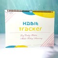 A4 habit tracking planner showing pink white cover with 12 internal pages for schedule recording